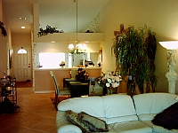 Living room,
view to bar, kitchen, and entrance.
CLICK on picture to enlarge. Later CLOSE (x) large picture.